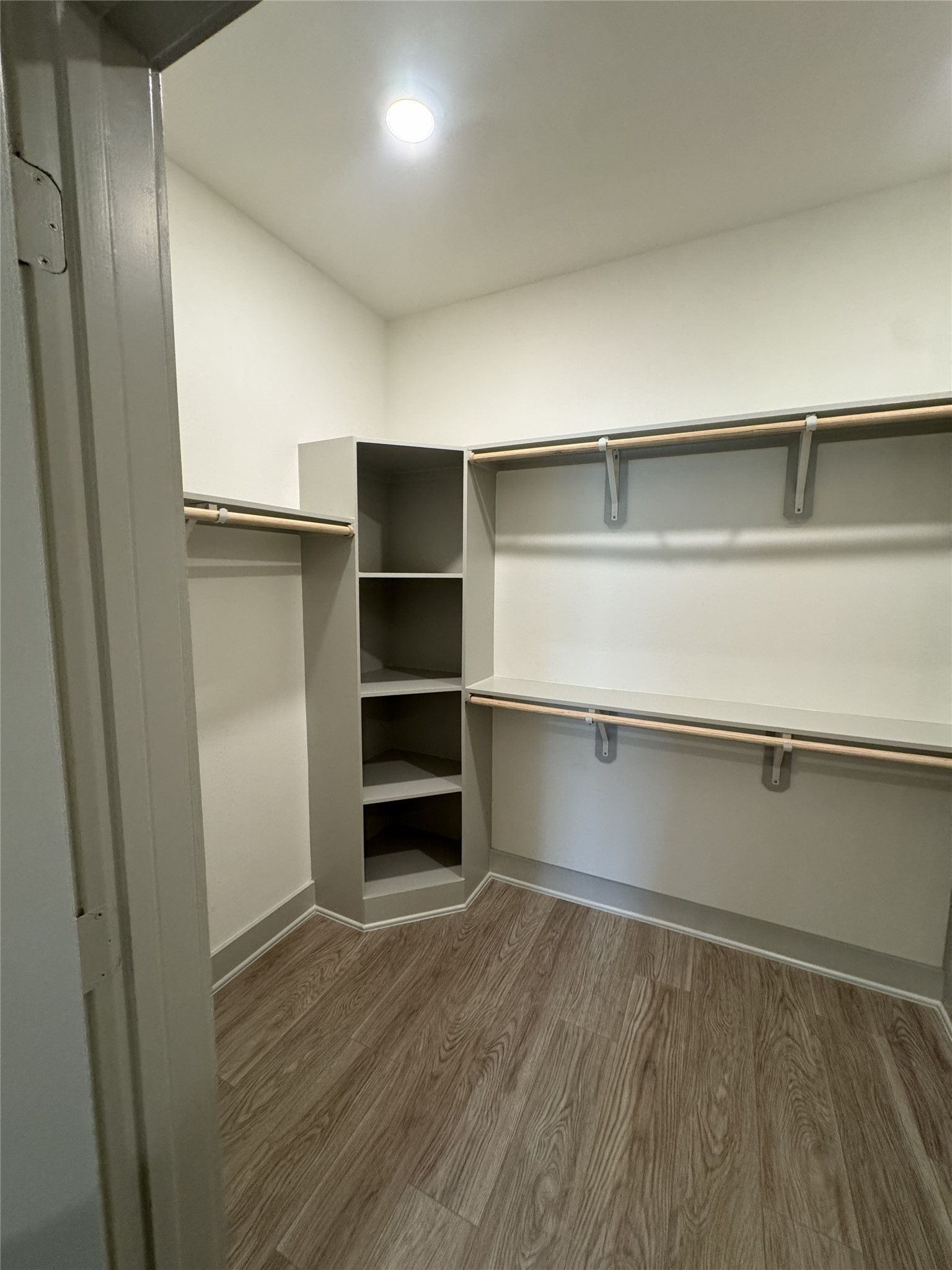 26244 Twin Oaks Road Splendora, TX 77372 - Photo 6 of 10 a view of walk in closet with empty racks