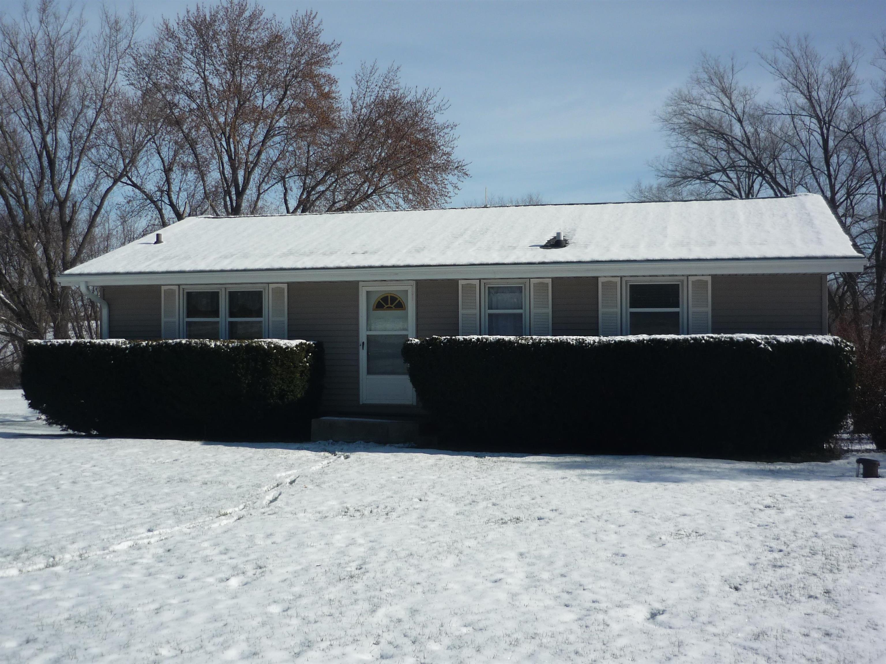 8539 North Pecatonica Road Pecatonica, IL 61063 - Photo 1 of 23 a front view of a house with a yard