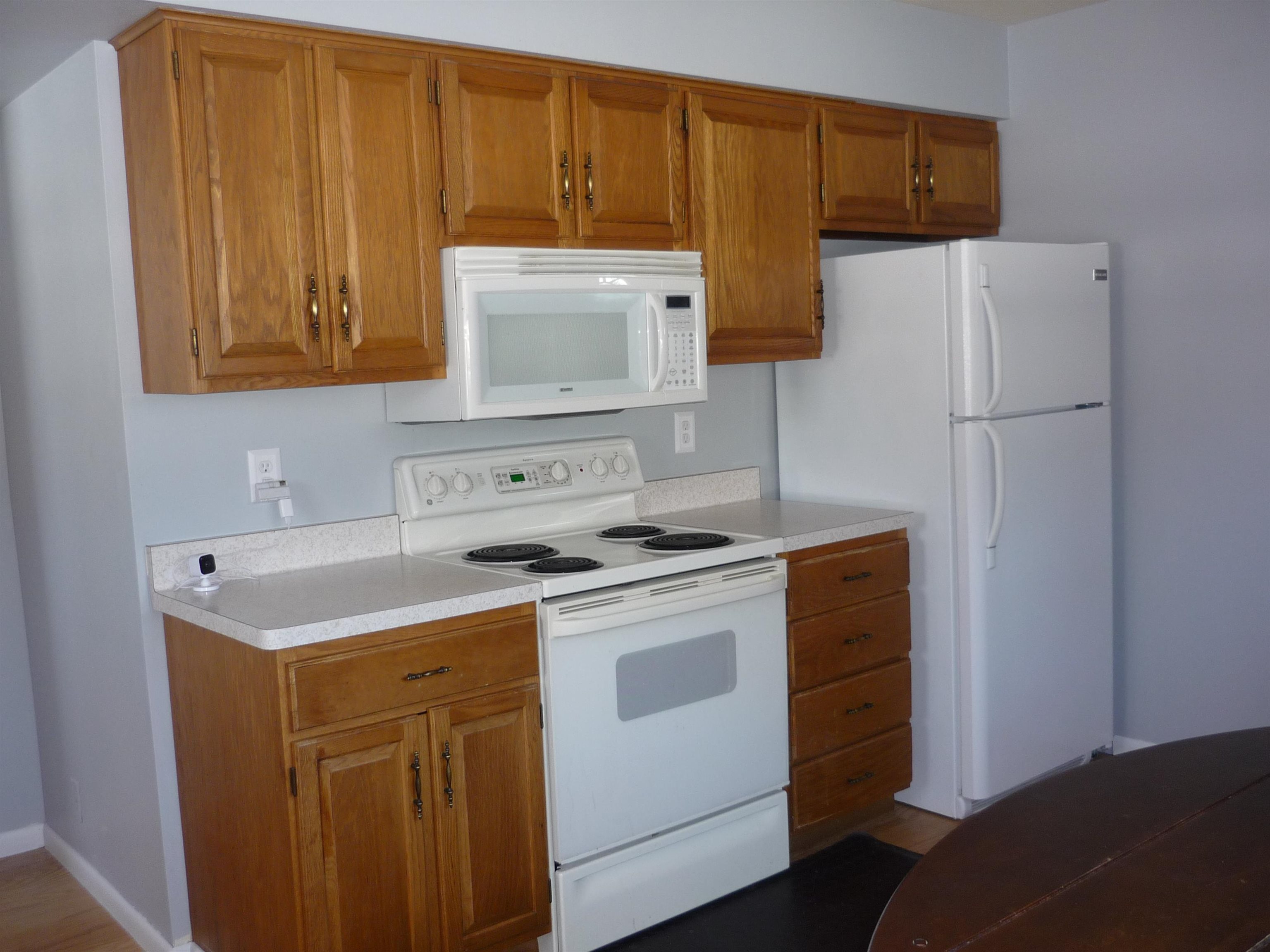 8539 North Pecatonica Road Pecatonica, IL 61063 - Photo 12 of 23 a kitchen with a stove top oven sink and cabinets