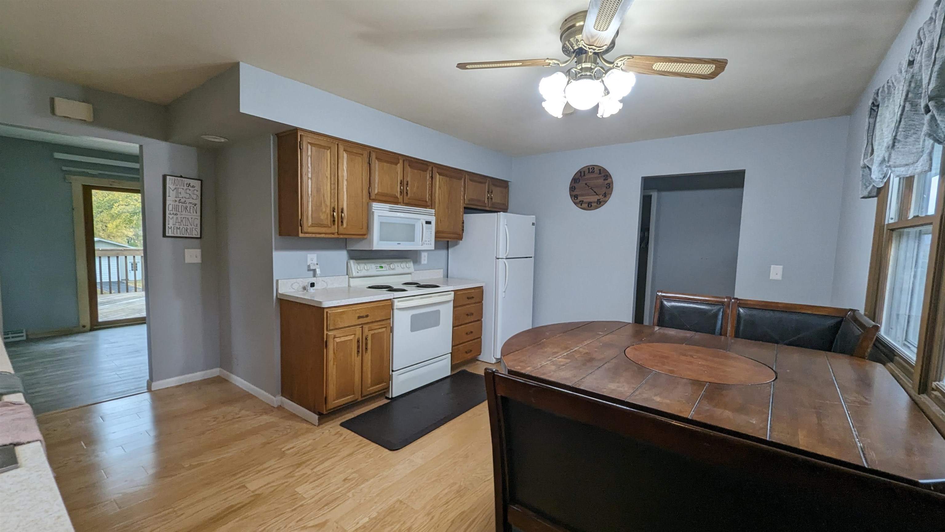 8539 North Pecatonica Road Pecatonica, IL 61063 - Photo 13 of 23 a kitchen with a stove a sink and a refrigerator