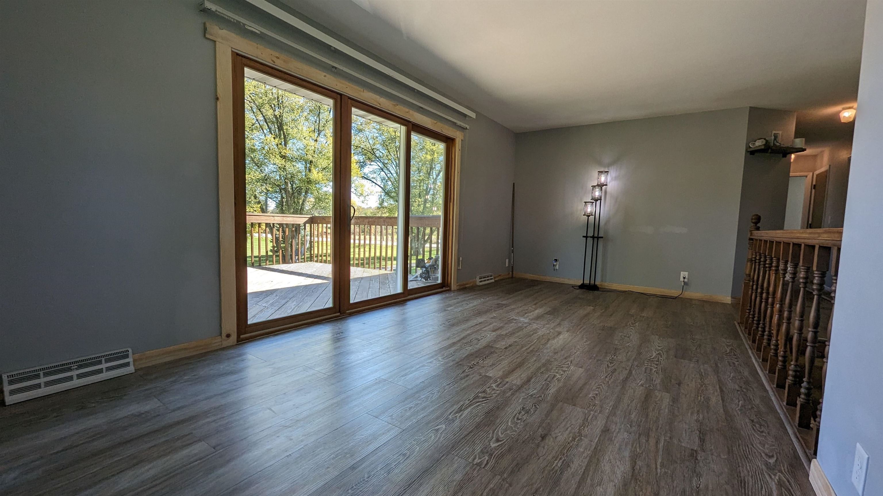 8539 North Pecatonica Road Pecatonica, IL 61063 - Photo 14 of 23 an empty room with wooden floor and windows