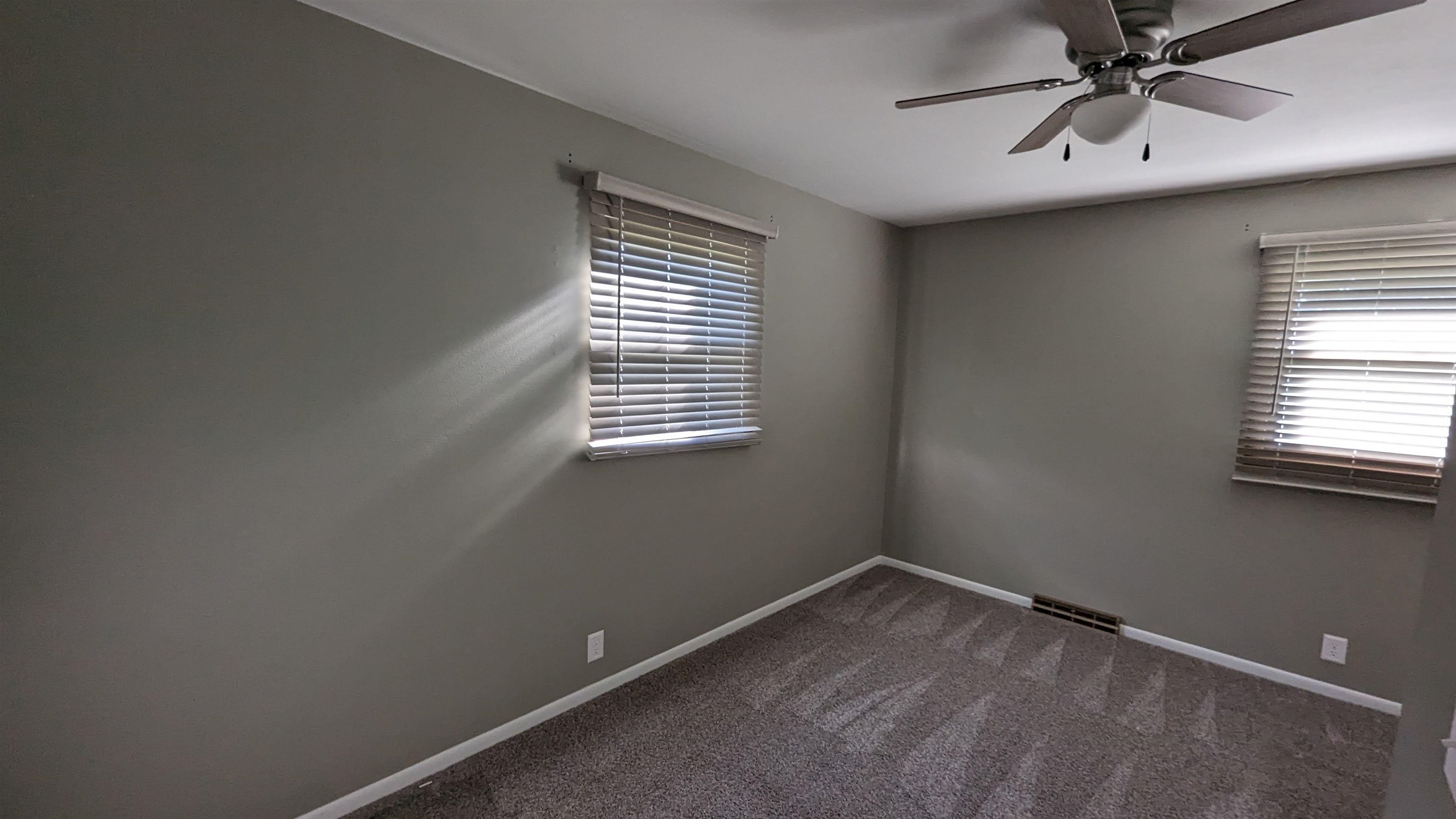 8539 North Pecatonica Road Pecatonica, IL 61063 - Photo 16 of 23 an empty room with windows and fan