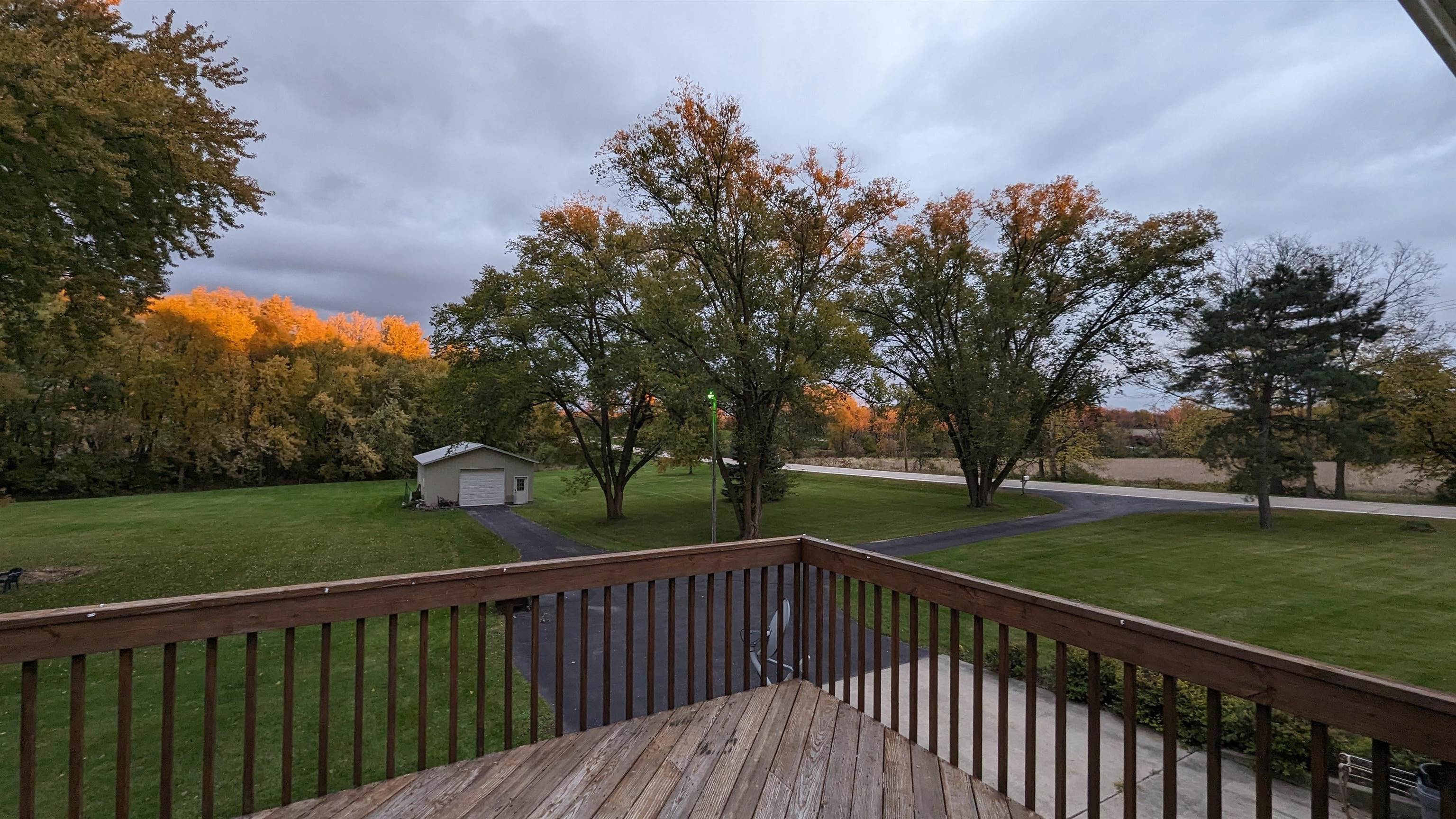 8539 North Pecatonica Road Pecatonica, IL 61063 - Photo 8 of 23 a balcony with wooden floor and trees