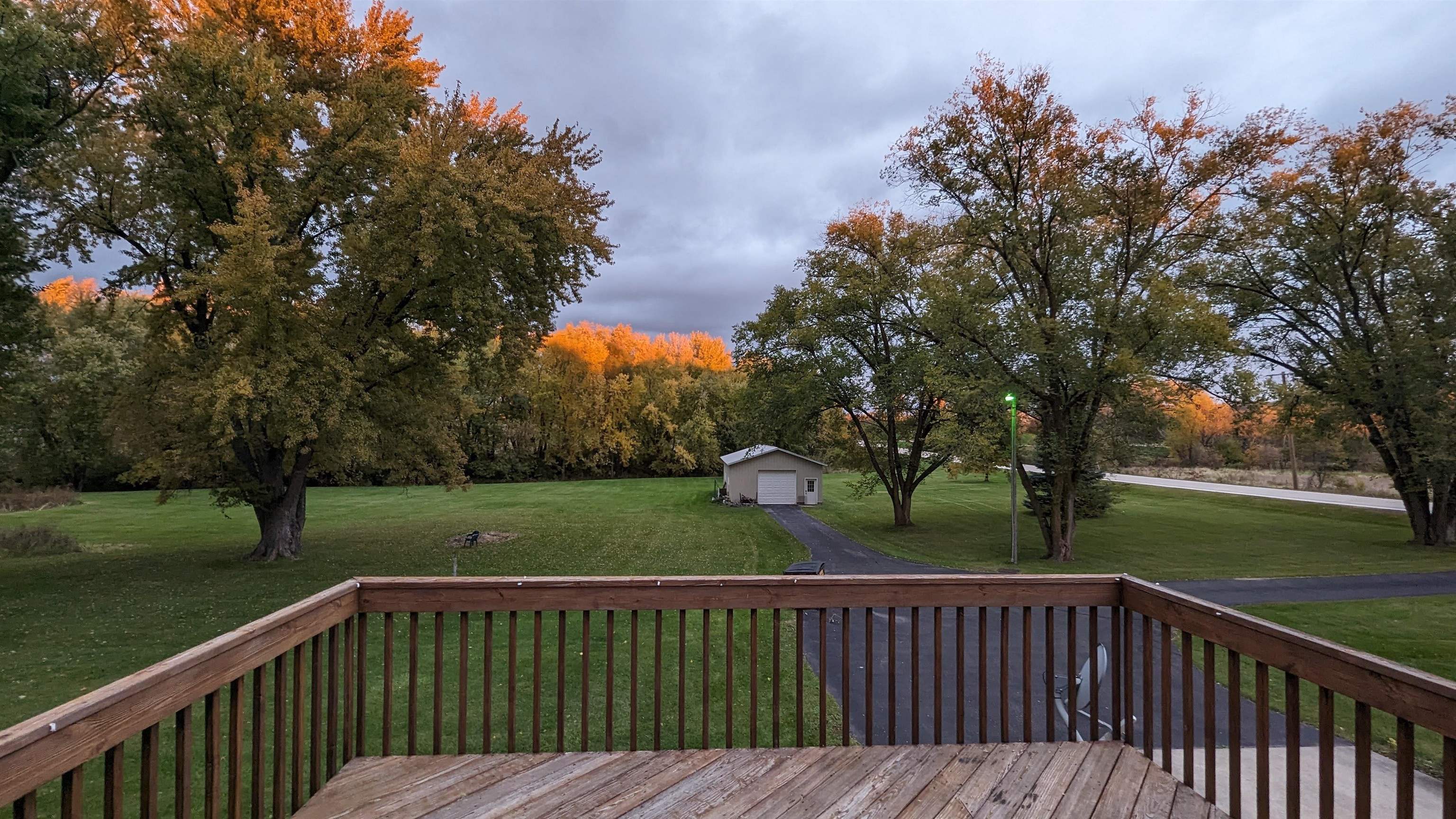 8539 North Pecatonica Road Pecatonica, IL 61063 - Photo 9 of 23 a view of deck and yard with trees