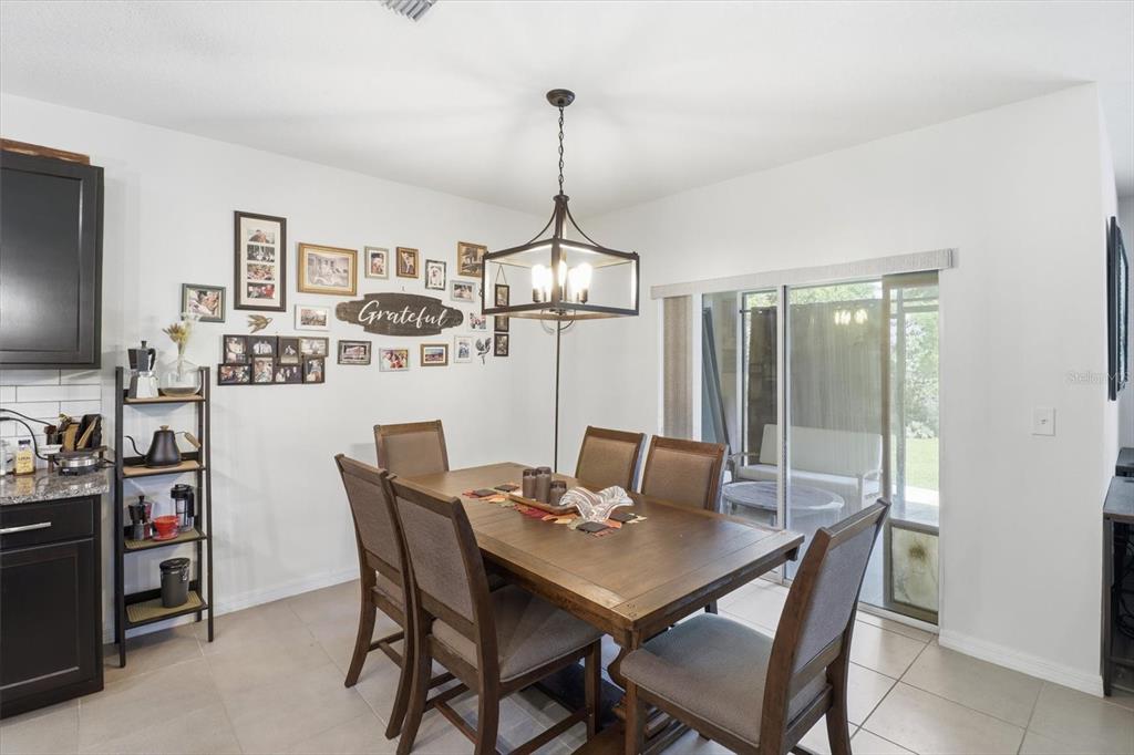 660 Hickory Course Loop Ocala, FL 34472 - Photo 15 of 45 a dining room with furniture and window