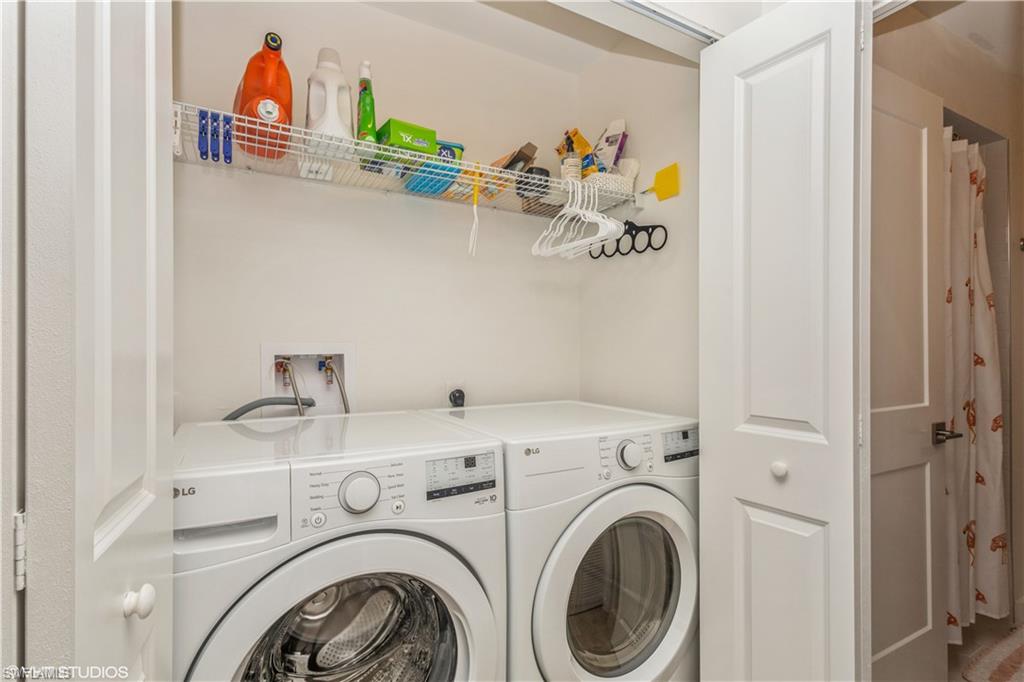 2608 Sailors Way, Unit 122 Naples, FL 34109 - Photo 33 of 47 a utility room with dryer and washer