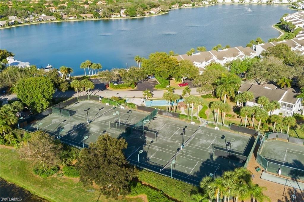 2608 Sailors Way, Unit 122 Naples, FL 34109 - Photo 47 of 47 a view of a lake with a yard