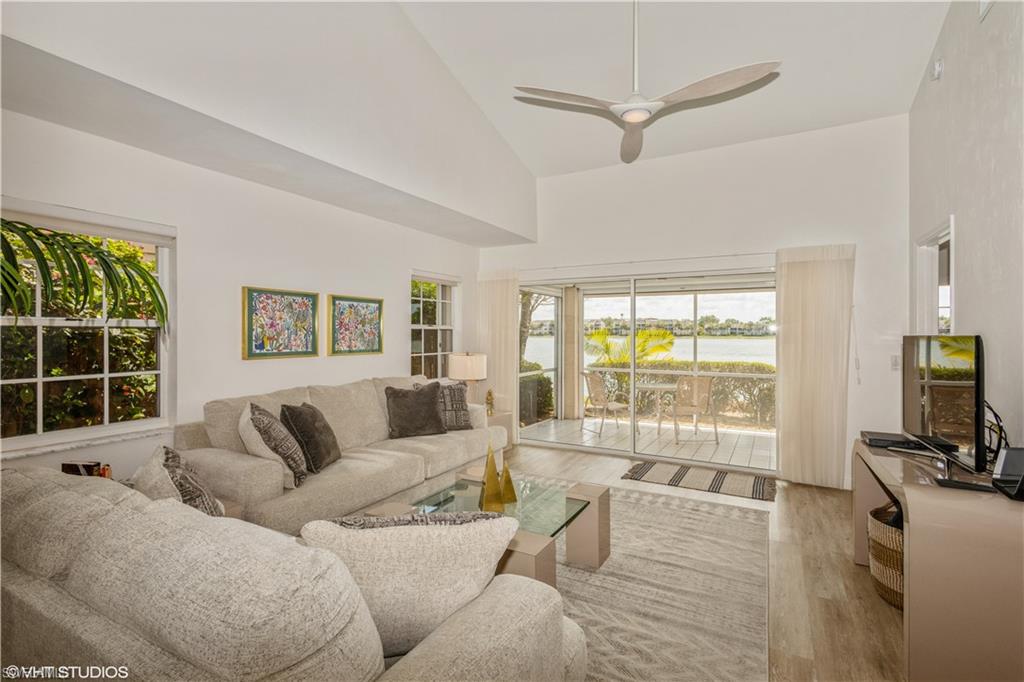 2608 Sailors Way, Unit 122 Naples, FL 34109 - Photo 8 of 47 a living room with furniture and a flat screen tv