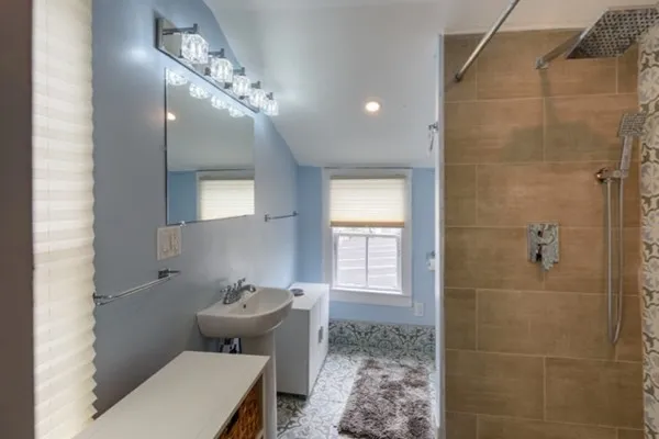a bathroom with a toilet sink and shower