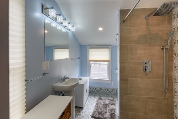 55 Samoset Avenue, Unit 1 Oak Bluffs, MA 02557 - Photo 7 of 10 a bathroom with a toilet sink and shower