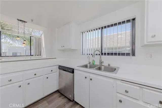 a kitchen with a sink and cabinets