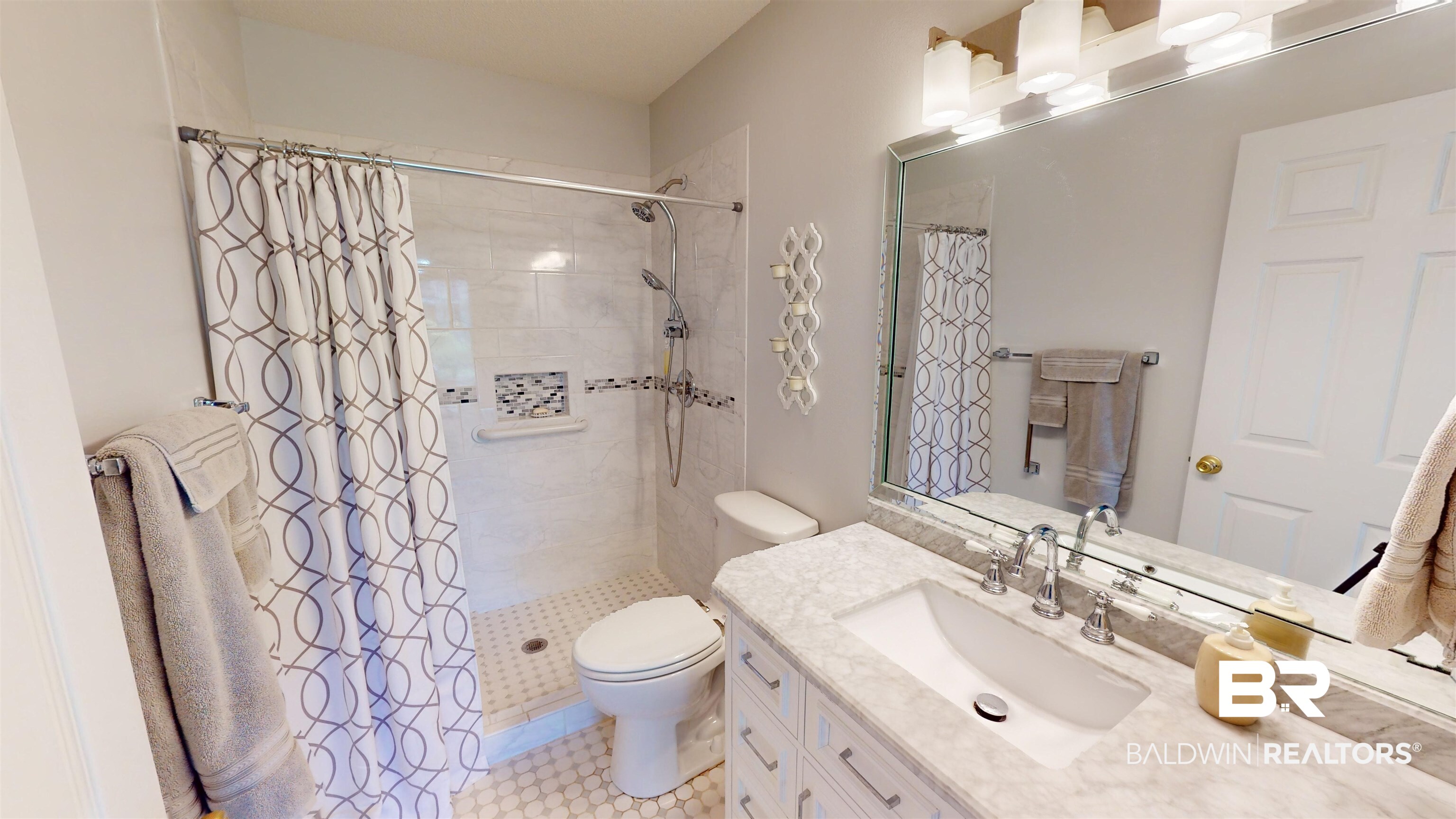 9445 Villas Drive Foley, AL 36535 - Photo 12 of 20 Bathroom featuring vanity, toilet, and a shower with curtain