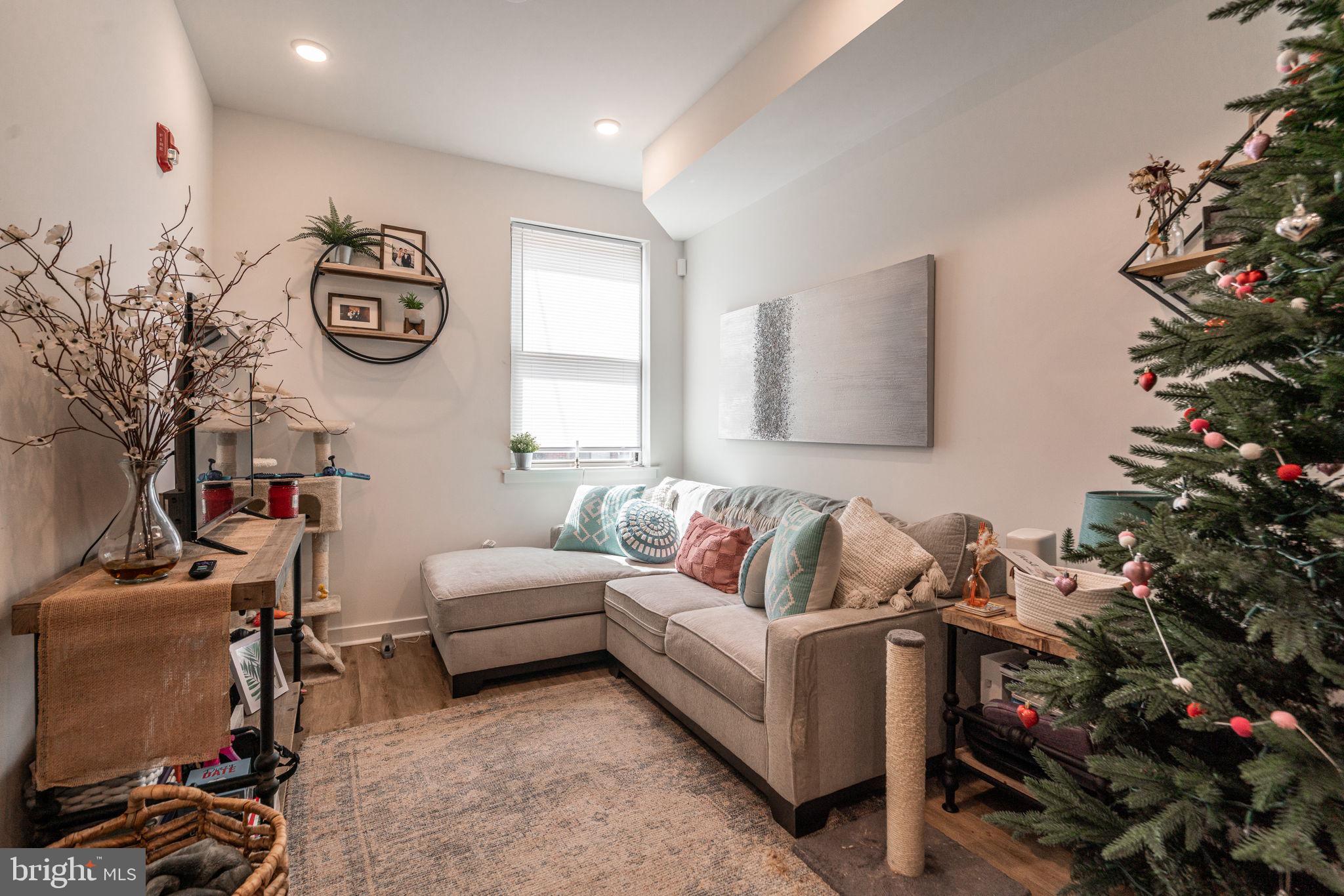 2613 Federal Street, Unit B Philadelphia, PA 19146 - Photo 2 of 21 a living room with furniture stairs and a potted plant