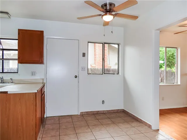 a view of a kitchen with a sink and a window