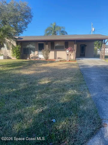 a front view of a building with garden