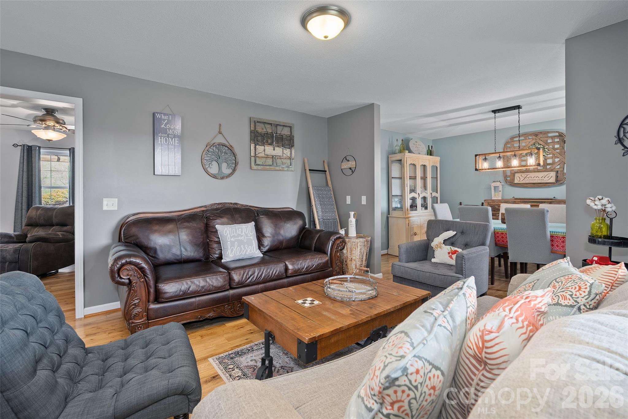 371 Ned Cove Road Waynesville, NC 28785 - Photo 11 of 44 a living room with furniture and a table