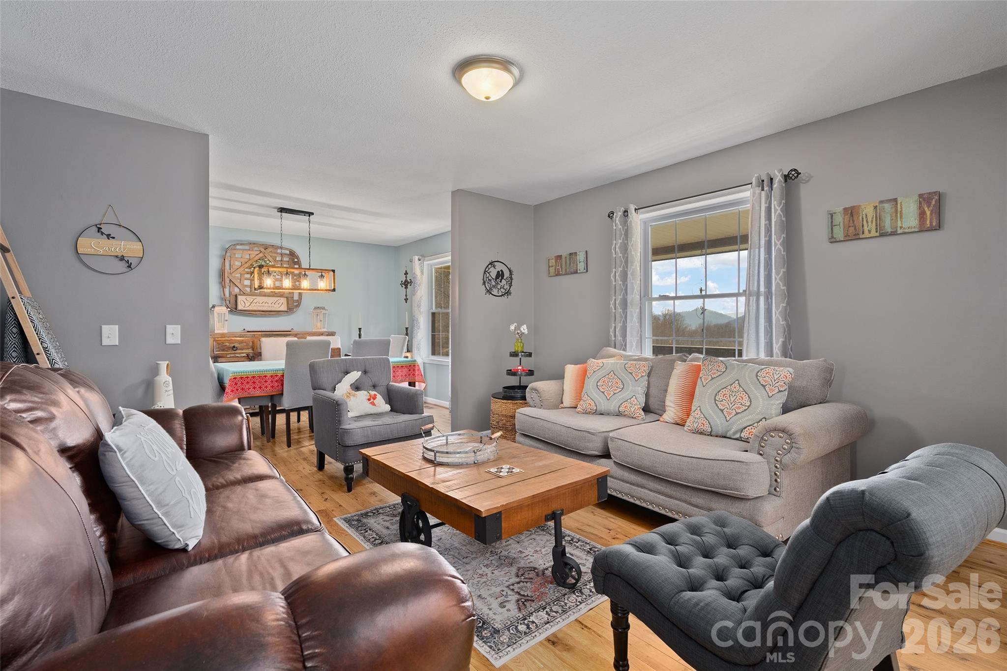 371 Ned Cove Road Waynesville, NC 28785 - Photo 12 of 44 a living room with furniture and a window