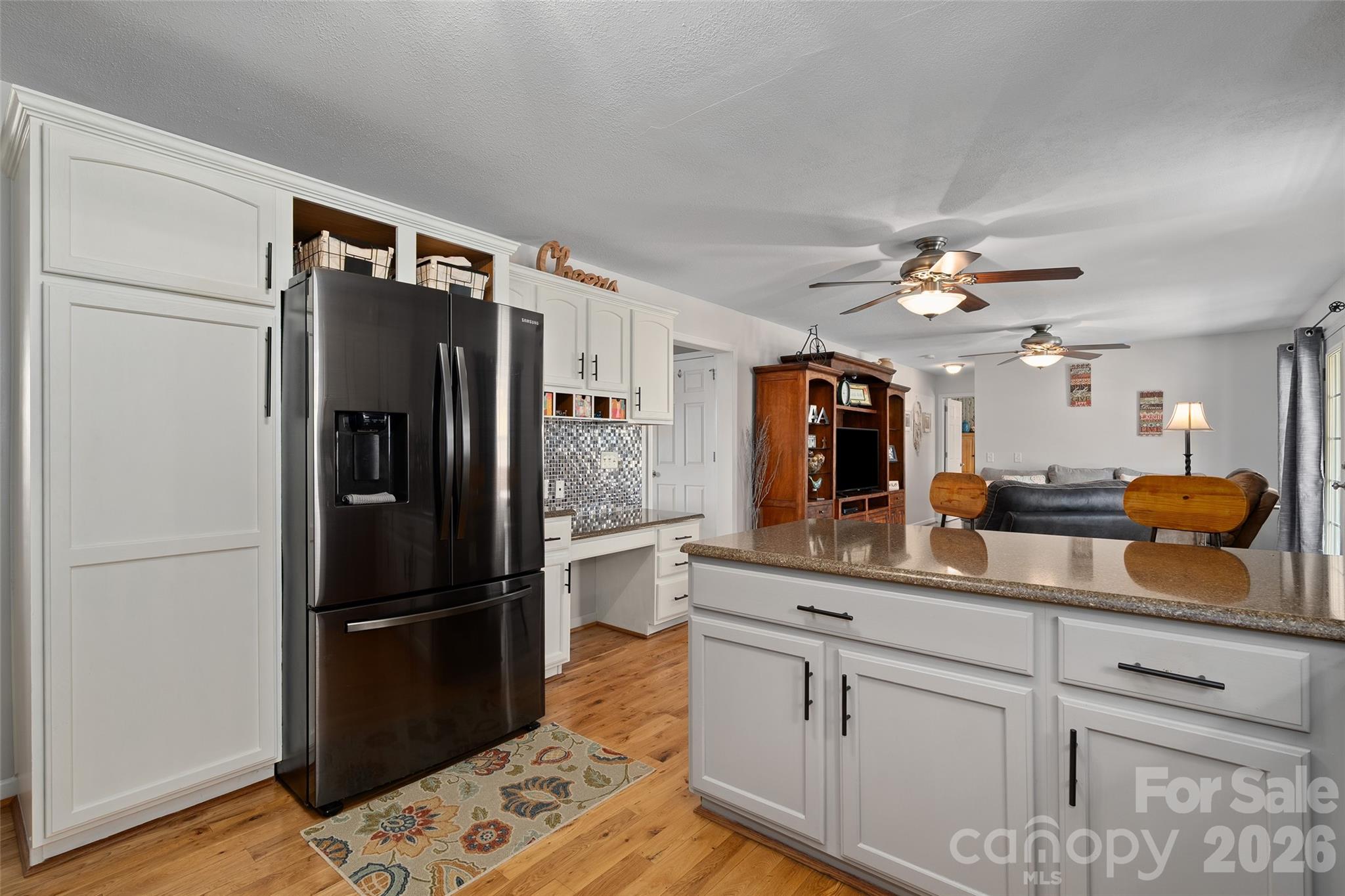 371 Ned Cove Road Waynesville, NC 28785 - Photo 16 of 44 a kitchen with refrigerator and cabinets