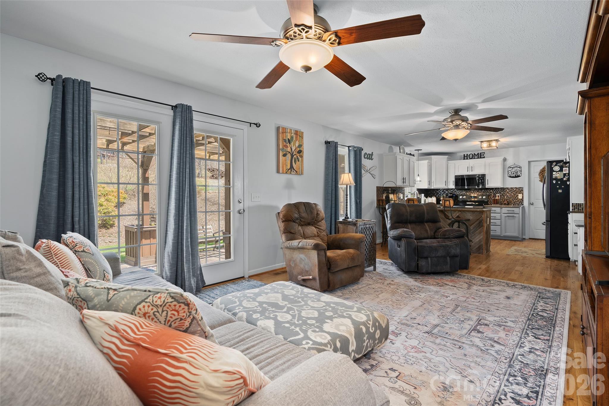 371 Ned Cove Road Waynesville, NC 28785 - Photo 18 of 44 a bed room with furniture and a window