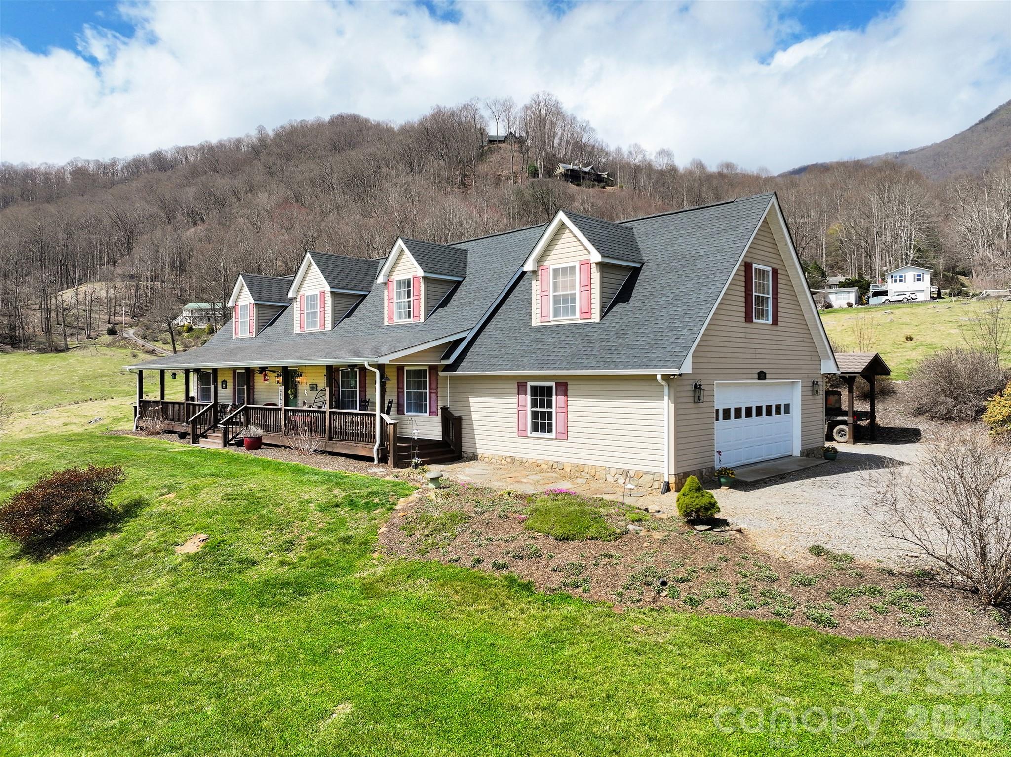 371 Ned Cove Road Waynesville, NC 28785 - Photo 2 of 44 a front view of a house with a yard