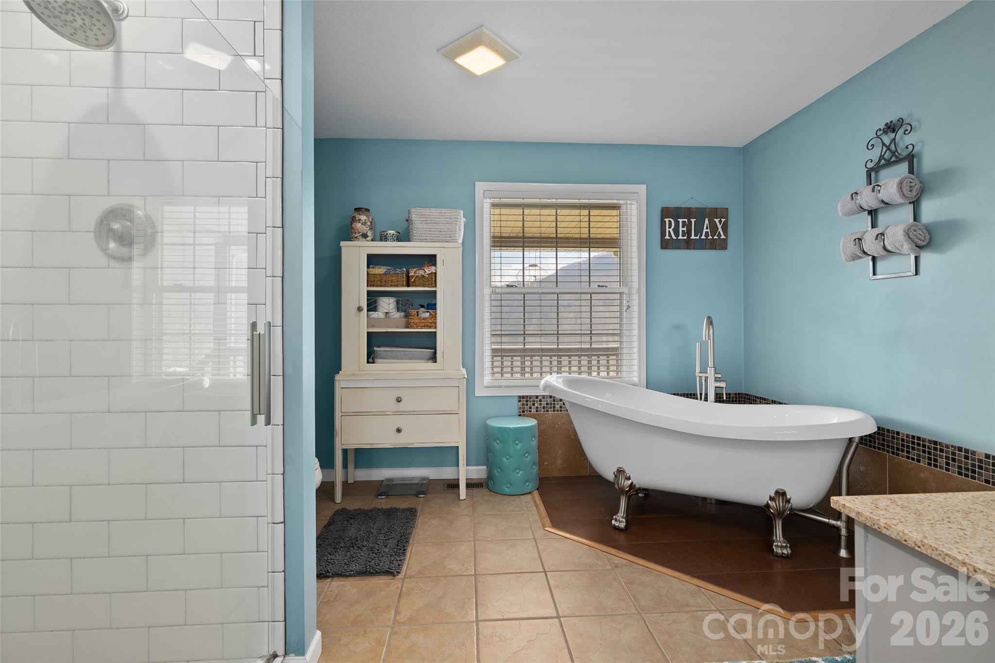 371 Ned Cove Road Waynesville, NC 28785 - Photo 26 of 44 a room with table chair and windows