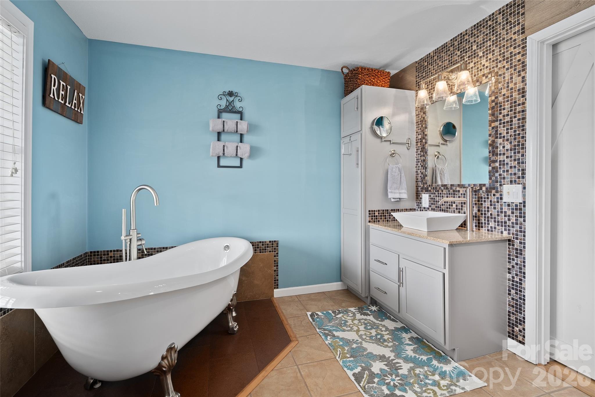 371 Ned Cove Road Waynesville, NC 28785 - Photo 27 of 44 a bathroom with a sink and a mirror