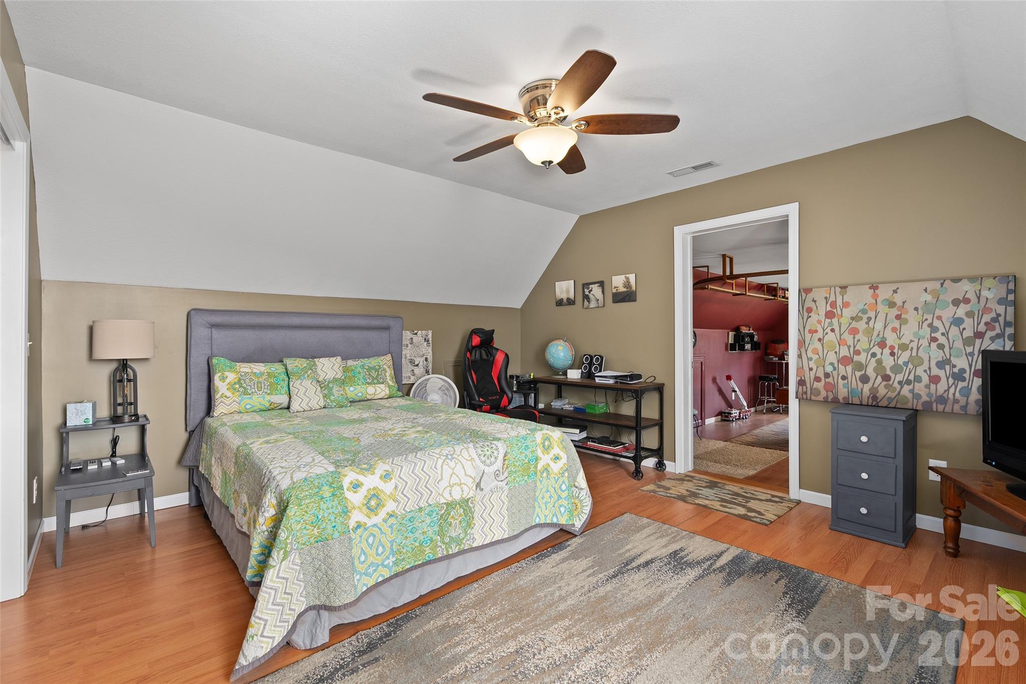 371 Ned Cove Road Waynesville, NC 28785 - Photo 35 of 44 a bedroom with a bed and a table in it