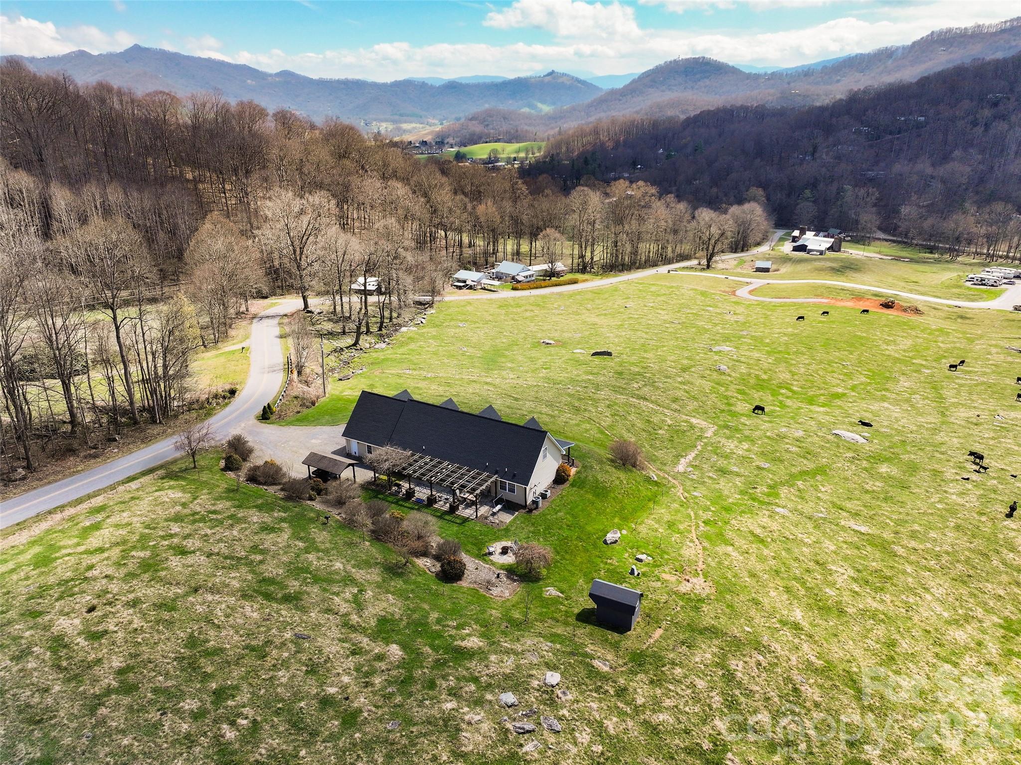 371 Ned Cove Road Waynesville, NC 28785 - Photo 42 of 44 a view of a lake with a mountain