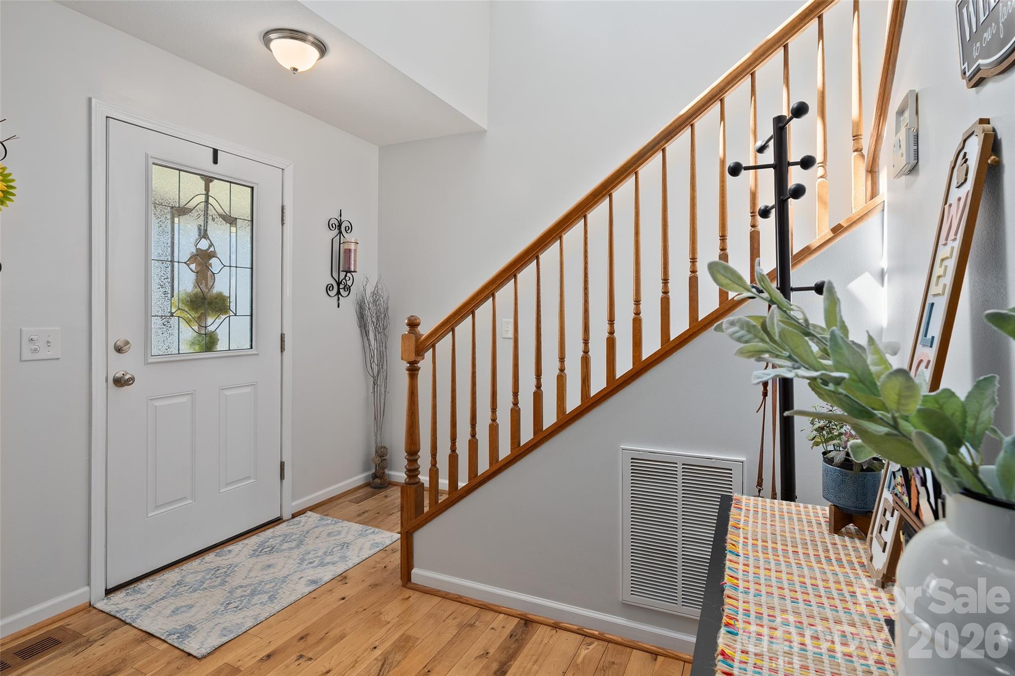 371 Ned Cove Road Waynesville, NC 28785 - Photo 9 of 44 a view of entryway with wooden floor and stairs