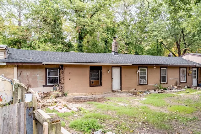 a backyard of a house with yard and garage