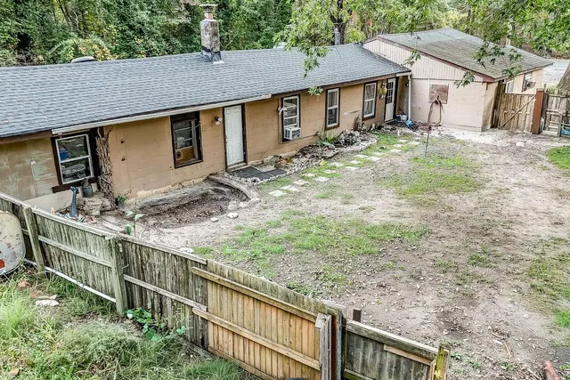 a backyard of a house with yard and seating area