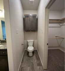 2611 136th Street Lubbock, TX 79423 - Photo 6 of 13 a bathroom with a toilet and a sink