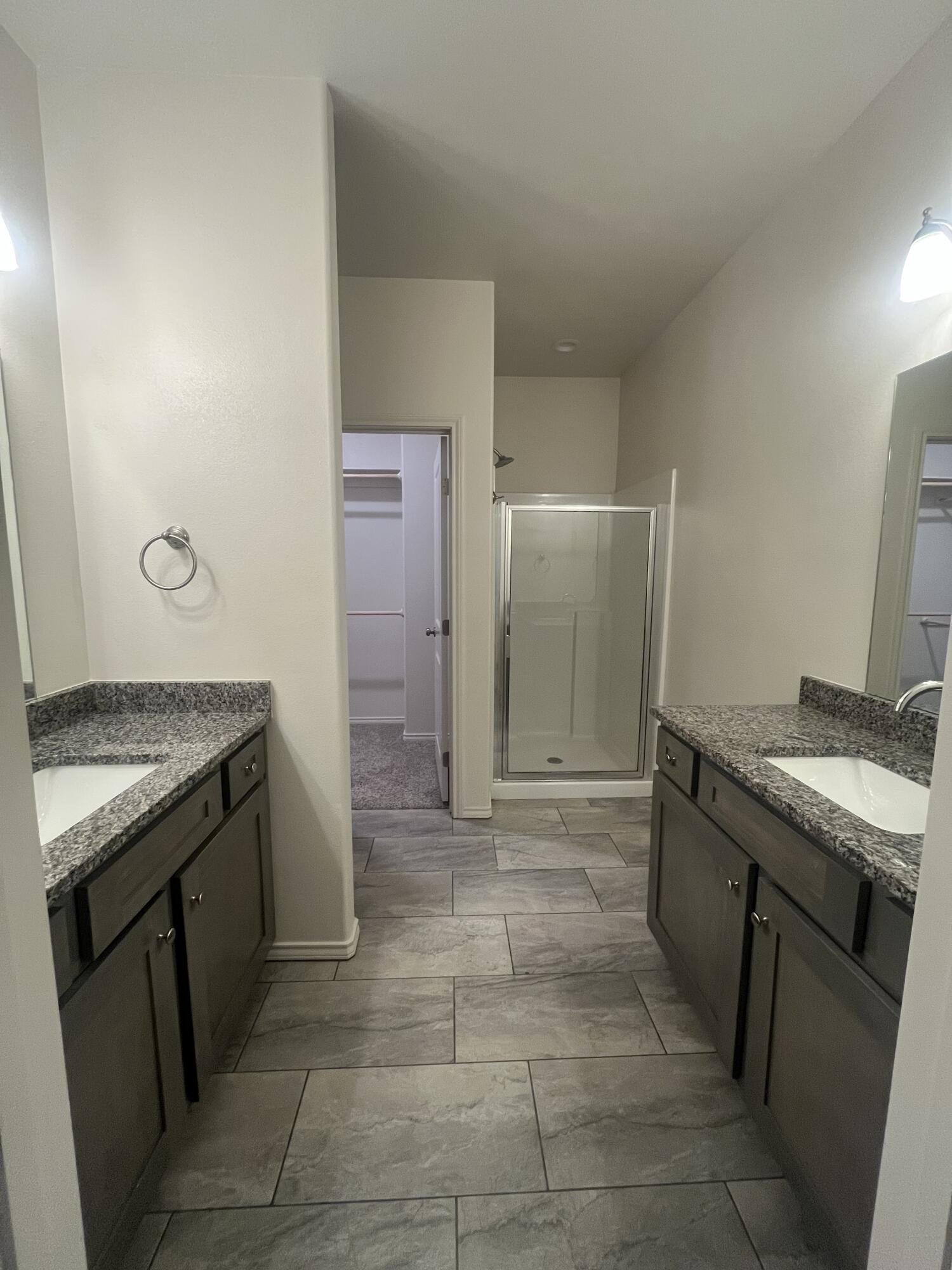 2611 136th Street Lubbock, TX 79423 - Photo 7 of 13 a kitchen with a stove top oven and cabinets
