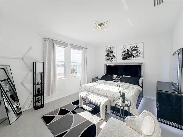 a bedroom with furniture and a fireplace