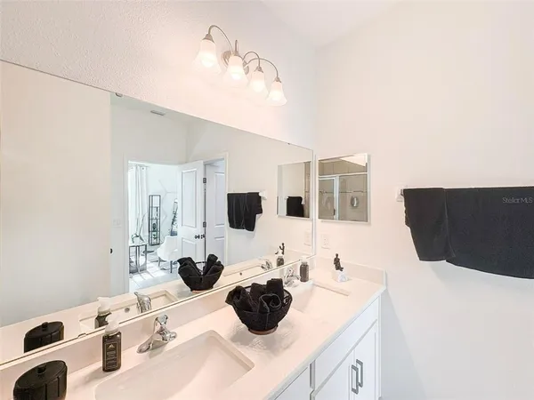 a kitchen with a sink and a refrigerator