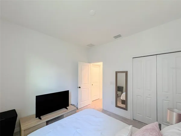 a view of a livingroom with an empty space and a window