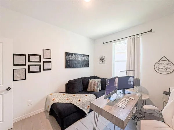 a bedroom with a bed and furniture