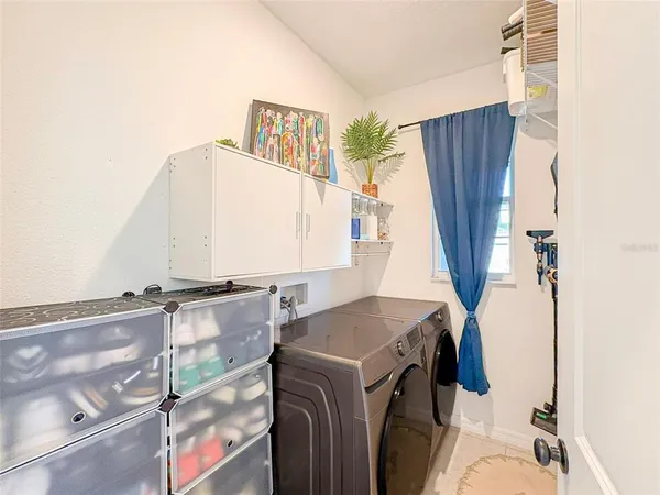a utility room with dryer and washer