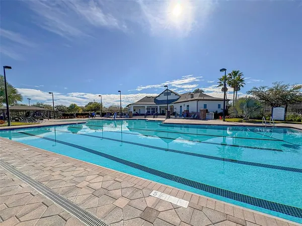 a view of houses with outdoor space and swimming pool