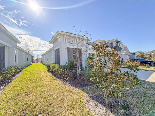 a view of a house with a backyard