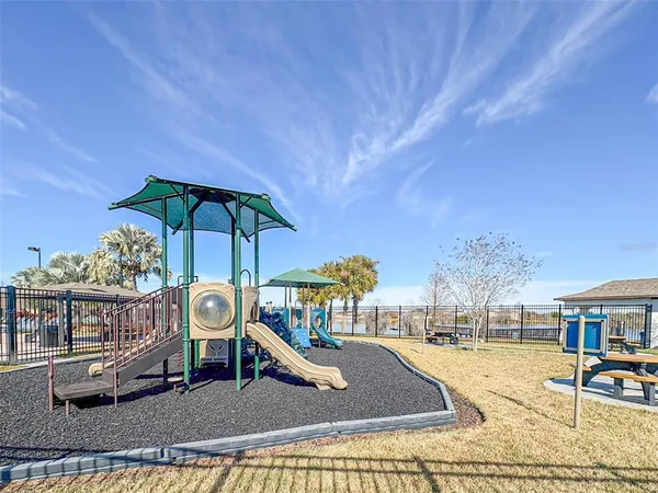 a view of a chairs and table in the patio