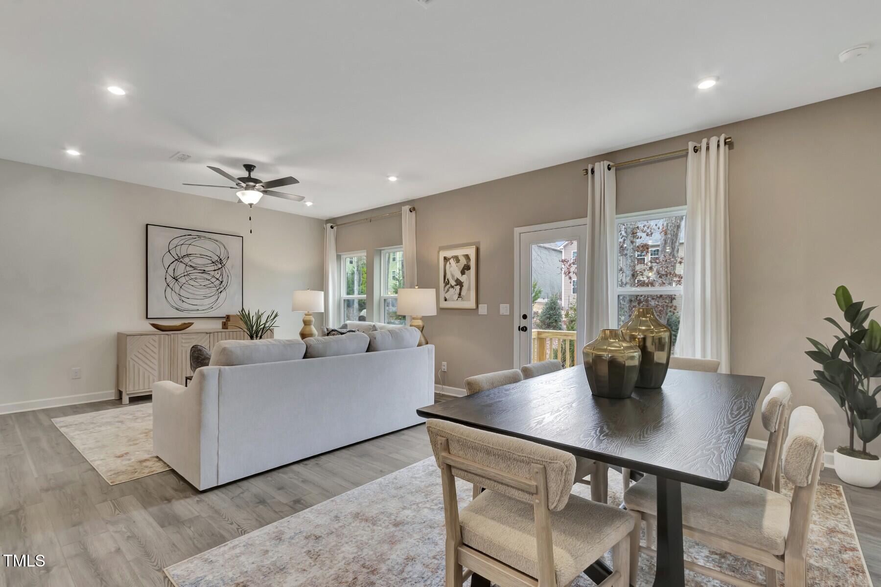 6972 Doddridge Lane Cary, NC 27519 - Photo 10 of 34 a living room with furniture and wooden floor