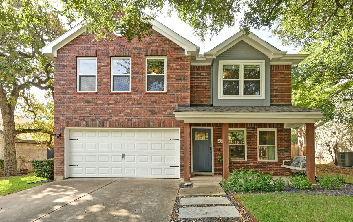 7041 Ridge Oak Road Austin, TX 78749 - Photo 1 of 1 front view of a house with a yard