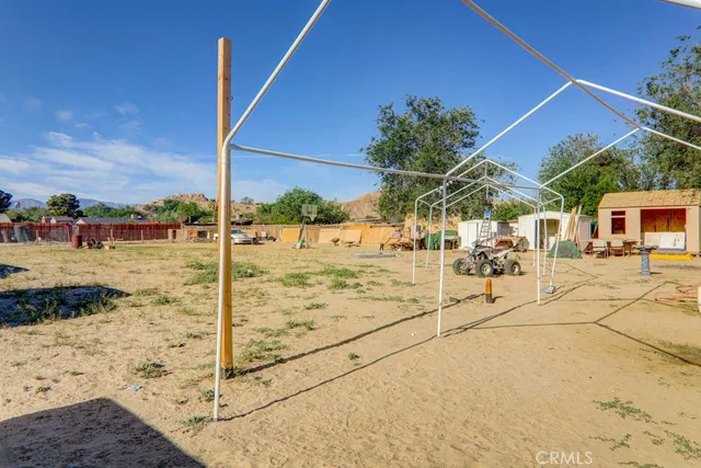 a view of a backyard of the house