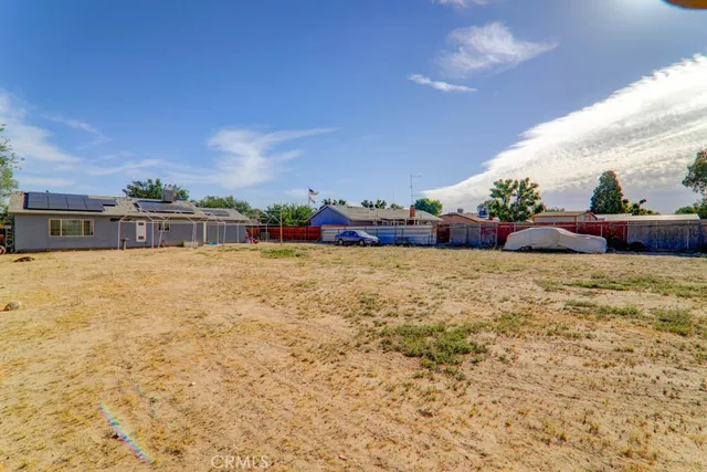 a view of swimming pool with outdoor seating and plants
