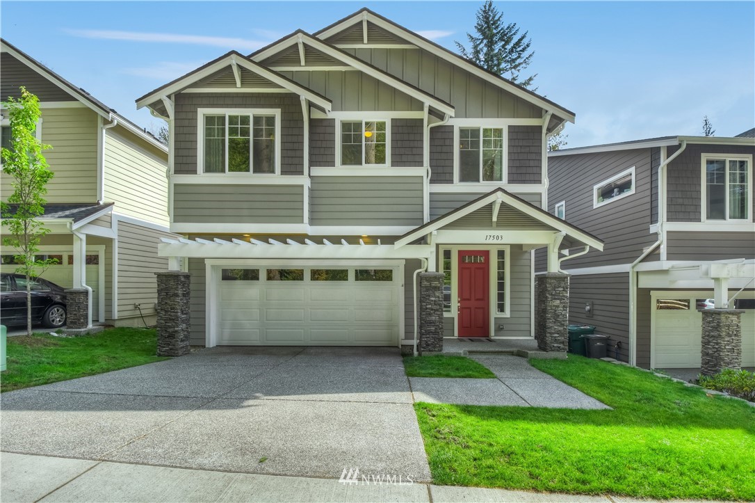 17503 3rd Avenue Southeast Bothell, WA 98012 - Photo 1 of 22 a front view of a house with a yard and garage