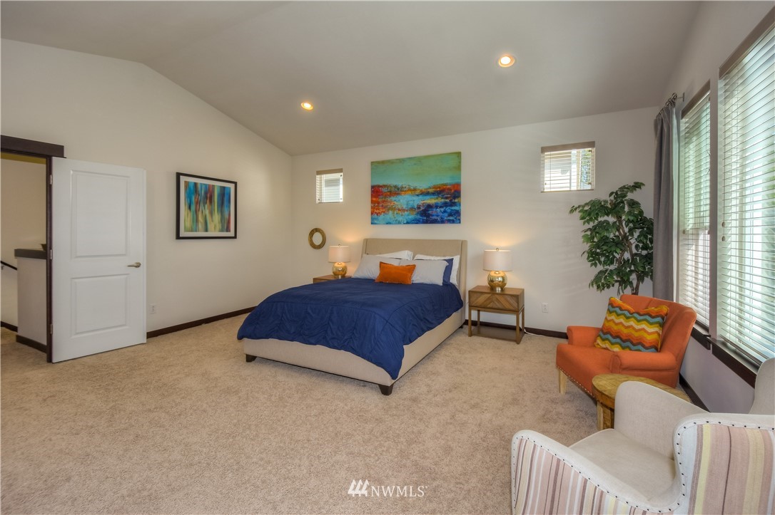 17503 3rd Avenue Southeast Bothell, WA 98012 - Photo 12 of 22 a spacious bedroom with a bed and a couch