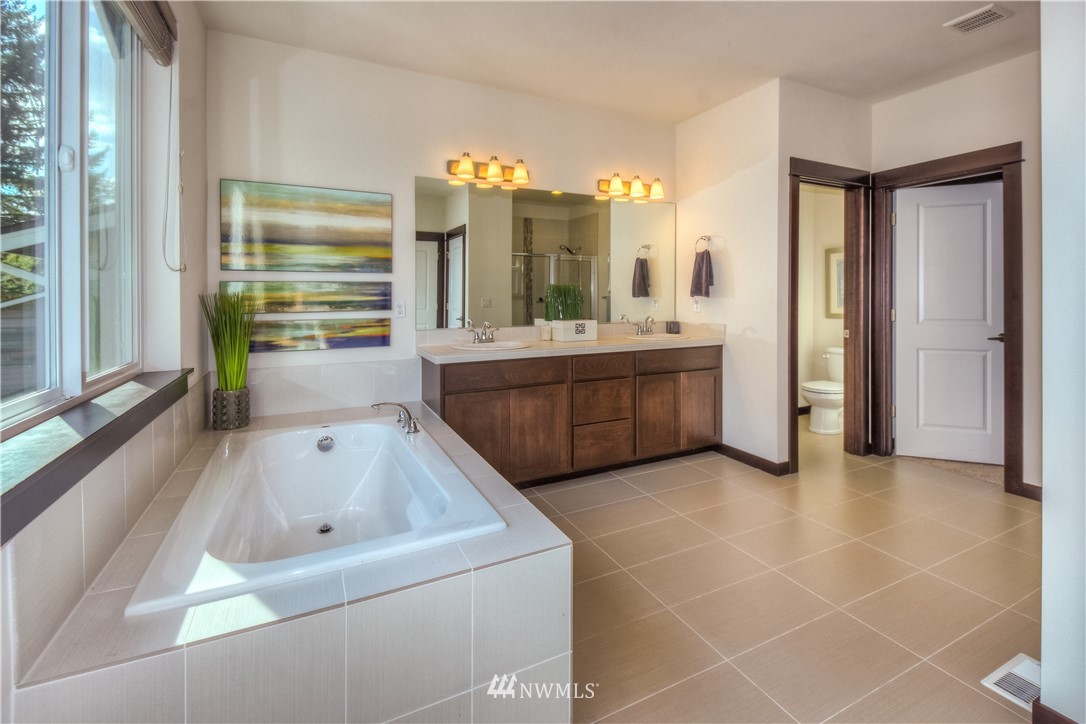 17503 3rd Avenue Southeast Bothell, WA 98012 - Photo 13 of 22 a bathroom with a tub sink and mirror