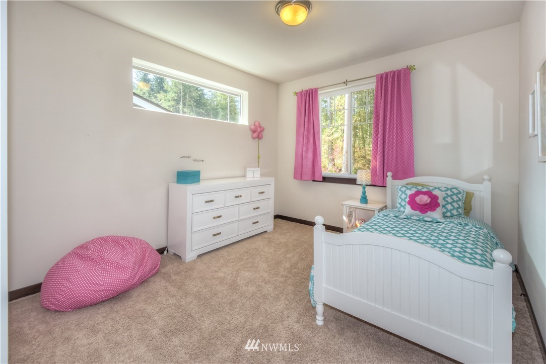 17503 3rd Avenue Southeast Bothell, WA 98012 - Photo 15 of 22 a bedroom with a bed and window