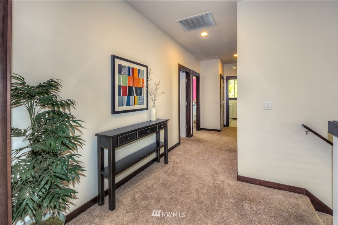 17503 3rd Avenue Southeast Bothell, WA 98012 - Photo 18 of 22 a view of hallway with a potted plant and a window